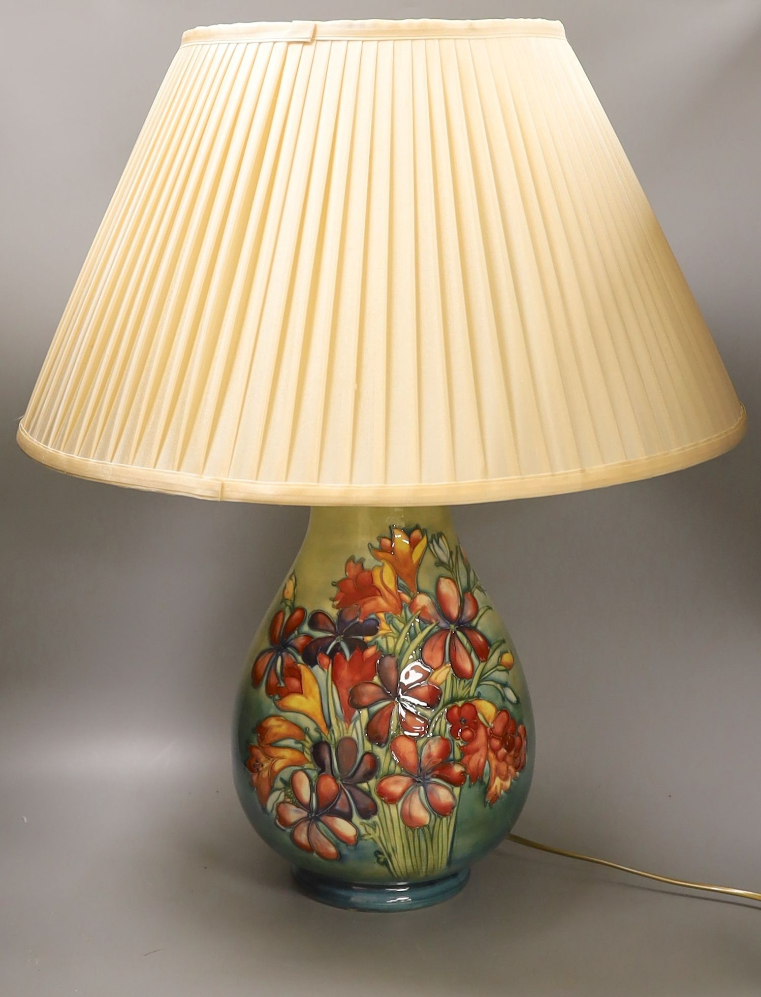 A large Moorcroft Spring Flowers table lamp base, 35 cms high.